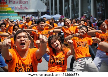BANGKOK - JUNE 30: A cheerleading flash mob dance troupe perform on a city centre street on June 30, 2013 in Bangkok, Thailand. Cheerleading dance teams are growing in popularity in the Thai capital.