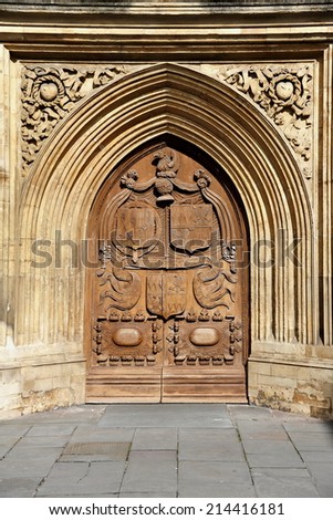 Beautiful Carved Wooden Oak Door of Bath Abbey or the Abbey Church of Saint Peter and Saint Paul in Bath England - The Historic City of Bath is a Popular Travel Destination with 4.5 mn visitors a year