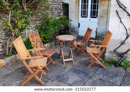 Wooden Garden Furniture on a Stone Patio - Garden Background