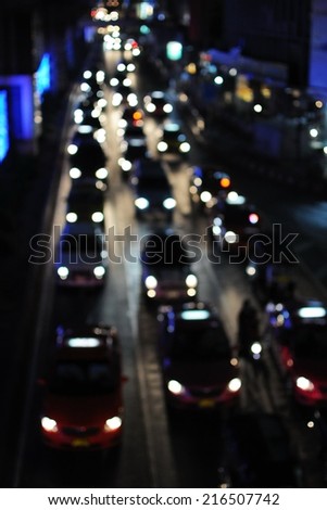 Defocused Lights of Heavy Traffic on a Busy City Road at Night