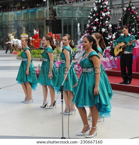 BANGKOK - DEC 23: An unidentified choir singers perform Christmas carols at Siam Paragon mall courtyard on Dec 23, 2011 in Bangkok, Thailand. Siam Paragon boasts 300,000 square metres of retail space.