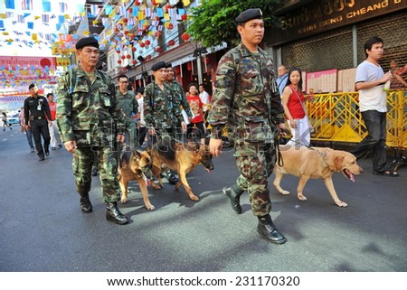 BANGKOK - JAN 23: Army patrol a Chinatown street before a visit by Thai royalty during celebrations of the Chinese New Year on Jan 23, 2012 in Bangkok, Thailand.