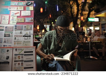 BANGKOK - MAR 29: An unidentified man sells fake ID documents on Khao San Road on Mar 29, 2012 in Bangkok, Thailand. The Thai capital is notorious for its trade in counterfeit and forged documents.