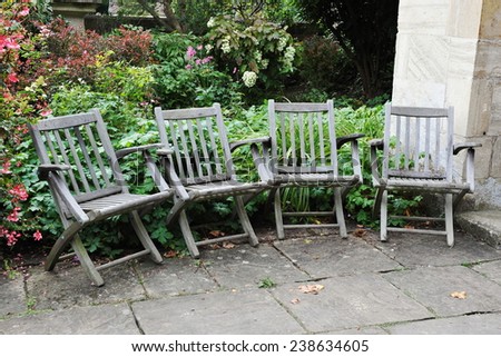Wooden Chairs on a Stone Patio Background