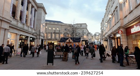 BATH - DEC 8: People walk through Southgate shopping district on Dec 8, 2014 in Bath, UK. The retail traders in the landmark Somerset city have reported busy trade in the run-up to Christmas.