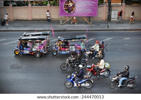 BANGKOK - MAR 6:  Motorcyclists wait at a busy junction in the city centre on Mar 6, 2013 in Bangkok, Thailand. Motorcycles are often the transport of choice for Bangkok\'s heavily congested roads.