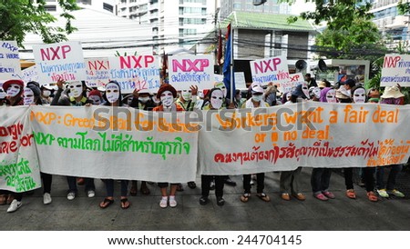 BANGKOK - MARCH 13: Thai NXP workers protest infront of the Royal Netherlands Embassy on March 13, 2013 in Bangkok, Thailand. Union workers gathered in calling for better wages and work conditions.