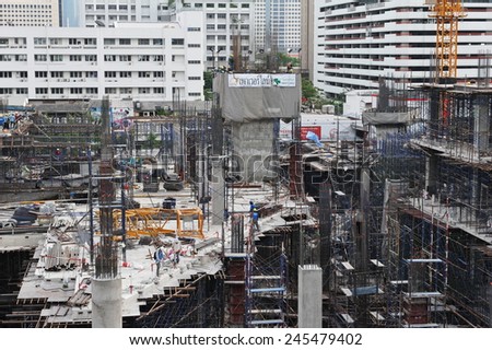 BANGKOK - MAR 20: A general view as labourers work on a high rise structure at a city centre construction site on Mar 20, 2013 in Bangkok, Thailand. The Thai capital is undergoing a construction boom.