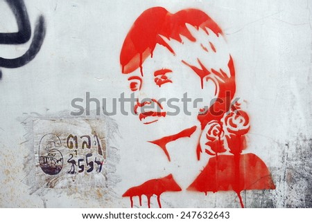 BANGKOK - JUN 1: View of stencil graffiti on a city centre wall of Aung San Suu Kyi by an unidentified artist on Jun 1, 2013 in Bangkok, Thailand. The Thai capital is known for its vibrant street art.