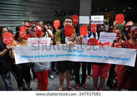 BANGKOK - JUN 2: Red Shirts protest on a city centre street to show support to the government and counter a large anti government rally earlier in the day on Jun 2, 2013 in Bangkok, Thailand.