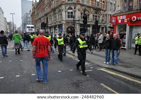 LONDON - MAR 26: Riot police deploy in the city center after violent riots break out during a 250,000 strong TUC organised anti public sector spending cuts rally on Mar 26, 2011 in London, UK.