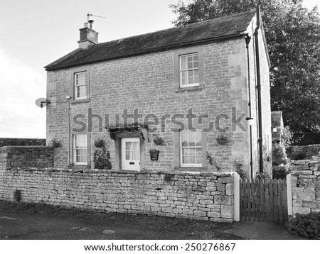 Exterior View of an Old Farmhouse in Black and White