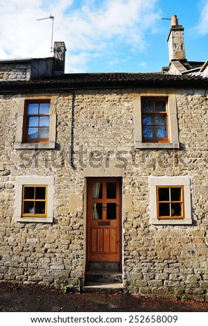 Exterior View of an Attractive Old English Cottage House