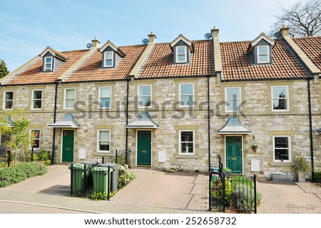 Exterior View of Terraced Stone Cottages on a Street in a Typical English Town