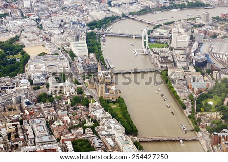 LONDON - JUNE 19: Aerial view of the River Thames as it runs through Westminster in the city centre of the British capital on June 19, 2010 in London, UK. The Thames is the longest river in England.