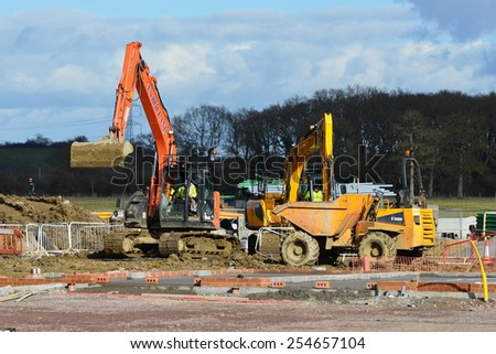 HILPERTON - FEB 21: View of a building site on Feb 21, 2015 in Hilperton, UK. The Wiltshire village is part of the UK\'s construction boom with the number of new homes being built up 10% since 2013.