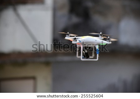 BANGKOK - JAN 17: A drone fitted with a camera flies above a political rally on Jan 17, 2014 in Bangkok, Thailand. There is currently no legislation regulating the use of drones in Thailand.