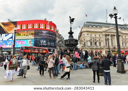 LONDON - MAY 30: Tourists visit the landmark Piccadilly Circus on May 30, 2015 in London, UK. With 16.8 million international arrivals in 2013, London is the 4th most visited city in the world.