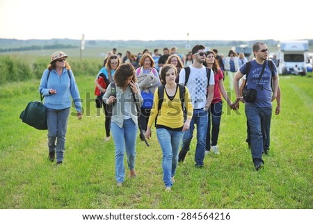 STONEHENGE - JUNE 20: Revelers make their way to Stonehenge to celebrate the Summer Solstice on June 20, 2014 in Stonehenge, UK. Thousands attended the event at the historical ancient standing stones.