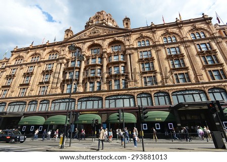 LONDON - JUN 16: People walk past the famous Harrods store on Jun 16, 2015 in London, UK. Opened in 1840 the landmark luxury department store covers 80,000 sq m of retail space in central London.