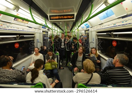 LONDON - JUN 16: People ride a Victoria Line underground train on Jun 16, 2015 in London, UK. Opened in 1863, the London Underground carried a record 1.26 billion passengers in the year 2013-2014.