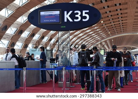 PARIS - JUN 18: Travelers queue at a departure gate at Charles de Gaulle Airport on Jun 18, 2015 in Paris, France. In 2014 Frances largest airport handled 64 million passengers and 498,000 aircrafts.