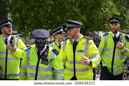LONDON - MAY 30: Police deploy during a rally against government public sector spending cuts following the re-election of the conservative party on May 30, 2015 in London, UK.