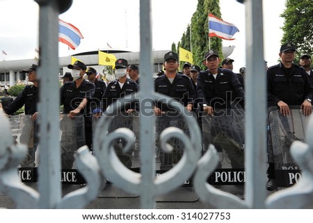 BANGKOK - MAY 31: Police officers stand guard outside the Thai Parliament as anti government protesters hold a rally in the vicinity on May 31, 2013 in Bangkok, Thailand.