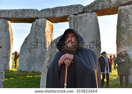 STONEHENGE - SEP 23: Pagans and druids celebrate the autumn equinox at the ancient standing stones on Mar 23, 2015 in Stonehenge, UK. The world famous landmark is thought to date back to 2600 BC.