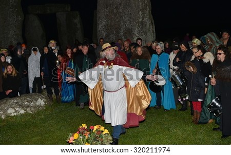 STONEHENGE - SEP 23: Pagans and druids celebrate the autumn equinox at the ancient standing stones on Sep 23, 2015 in Stonehenge, UK. The world famous landmark is thought to date back to 2600 BC.