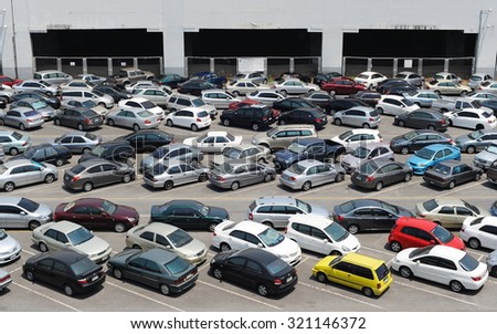 BANGKOK - APR 5: View of cars at a park and ride lot at a BTS station in Chatuchak district on Apr 5, 2013 in Bangkok, Thailand. The government has promoted park and ride to reduce traffic congestion.
