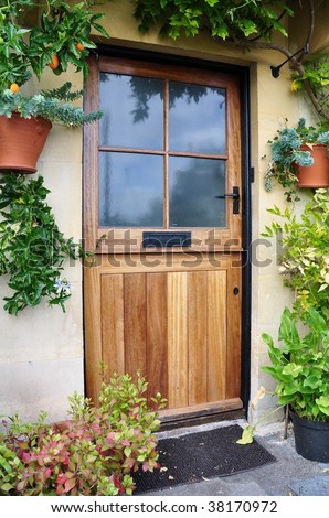 Front Door of an Old Cottage, Surrounded by Plants