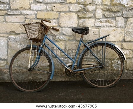 Old Bicycle against a Stone Wall