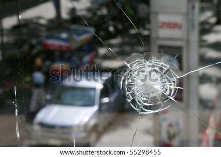 BANGKOK - MAY 23: Window of Zen Central World shopping mall damaged by gunfire and the scene of multiple killings during the anti government \'Red Shirt\' protest May 23, 2010 in Bangkok, Thailand