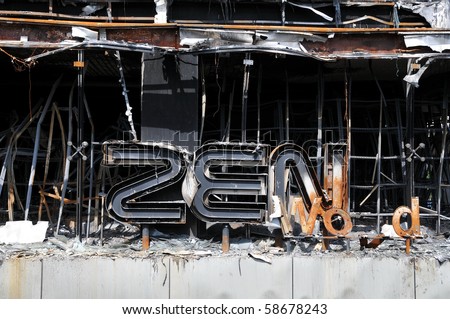 BANGKOK - MAY 23: Fire damaged exterior of Zen Central World shopping mall in the aftermath of the anti government \'Red Shirt\' protest May 23, 2010 in Bangkok, Thailand.
