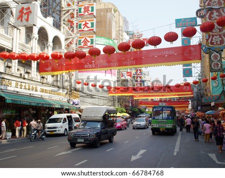 BANGKOK - FEBRUARY 14: Red lanterns and decorations span Yaowarat Road in Bangkok\'s Chinatown district during the Chinese New Year celebrations on February 14, 2010 in Bangkok, Thailand.