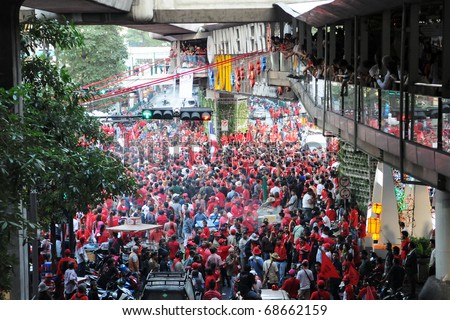 BANGKOK - JANUARY 9: 30,000 anti government Red Shirts protest at Rachaprasong junction on January 9, 2011 in Bangkok, Thailand. The Red Shirts are calling for political change and fresh elections.