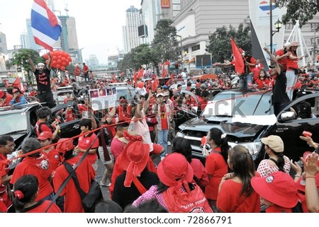 BANGKOK - DECEMBER 19: An estimated 10,000 anti-government red-shirts defy an emergency decree to protest at Ratchaprasong Junction December 19, 2010 in Bangkok, Thailand.