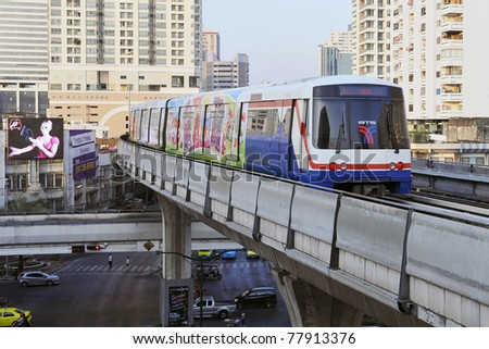 BANGKOK - JANUARY 7: BTS Skytrain speeds through the city center January 7, 2011 in Bangkok, Thailand. The mass transit rail network recently marked its 10th year of service in the Thai capital.