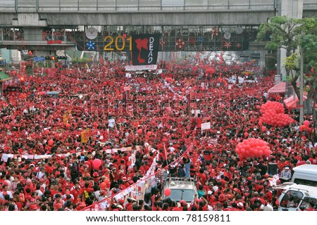 BANGKOK - DECEMBER 19: Thousands of anti-government red-shirt protesters defy an emergency decree to protest at Ratchaprasong Junction on December 19, 2010 in Bangkok, Thailand.