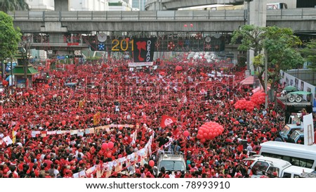 BANGKOK - DECEMBER 19: Thousands of anti-government red-shirt protesters defy an emergency decree to rally at Ratchaprasong Junction on December 19, 2010 in Bangkok, Thailand.