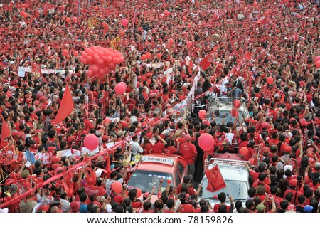 BANGKOK - DECEMBER 19: Thousands of anti-government red-shirt protesters defy an emergency decree to protest at Ratchaprasong Junction on December 19, 2010 in Bangkok, Thailand.