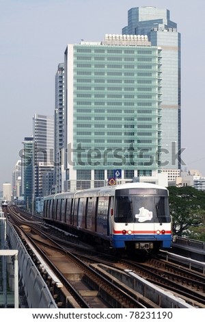 BANGKOK - FEB 7: BTS Skytrain approaches a station on Sukhumvit Road as the BTS rail network celebrates its 10th anniversary of operations in the Thai capital on Feb 7, 2010 in Bangkok, Thailand.