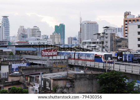 BANGKOK - JUNE 16: Bangkok skyline with Bangkok Mass Transit System (BTS) train departing a station as rail network celebrates its 10th anniversary of operations June 16, 2010 in Bangkok, Thailand.