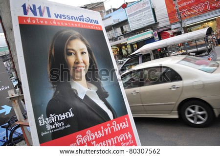 BANGKOK - JUNE 26: A roadside election campaign placard endorsing Pheu Thai Party and its leader Yingluck Shinawatra June 26, 2011 in Bangkok, Thailand. Thais go to the polls on 3rd July.