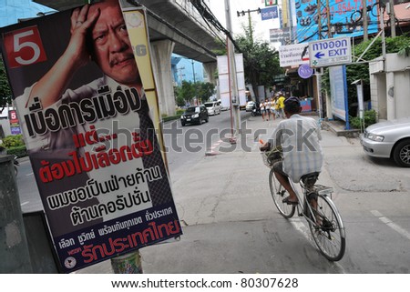 BANGKOK - JUNE 25: A roadside election campaign placard endorsing Chuwit Kamolvisit\'s Rak Thailand party June 25, 2011 in Bangkok, Thailand. Thais go to the polls on 3rd July.