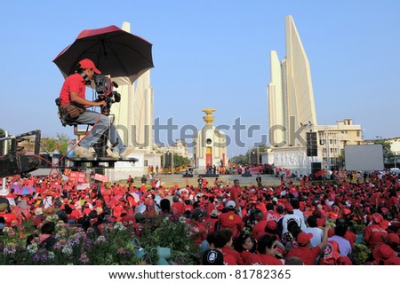 BANGKOK - FEB 13: Thousands of anti-government red-shirt protesters converge at Democracy Monument on Feb 13, 2011 in Bangkok, Thailand. The red-shirts are calling for political change.