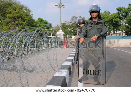 BANGKOK - JAN 25: Police Commandos guard a barricade on Makkhawan Bridge outside Government HQ on Jan 25, 2011 in Bangkok, Thailand. The Thai capital continues to see street protests and bomb alerts.