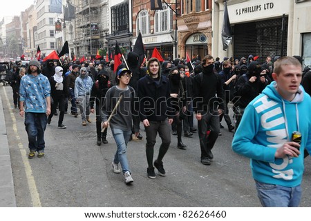 LONDON - MARCH 26: A breakaway group of protesters march through the streets of the British capital during a large anti-cuts rally 26 March 2011 in London, UK.
