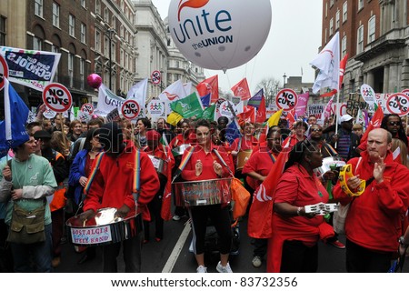 LONDON - MARCH 26: A steel band plays as protesters march against spending cuts to the public sector March 26 2011, in London, UK. An estimated 250,000 people attended the TUC organised rally.